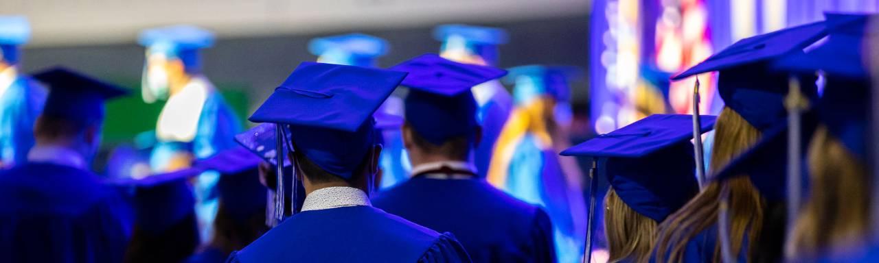 Group of students in cap and gowns during commencement